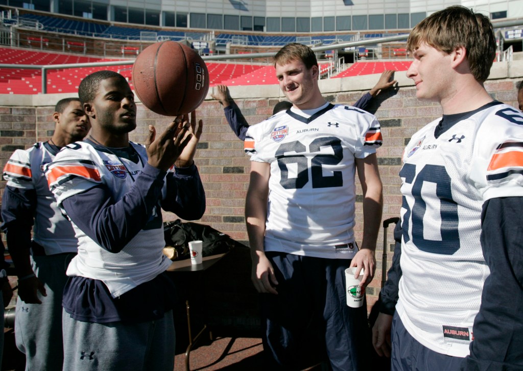 Robert Shiver (L) played three seasons for Auburn as a long snapper in the late 2000s.