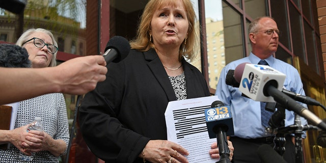 Teresa Lancaster with reporters