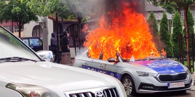 Police car on fire in Kosovo