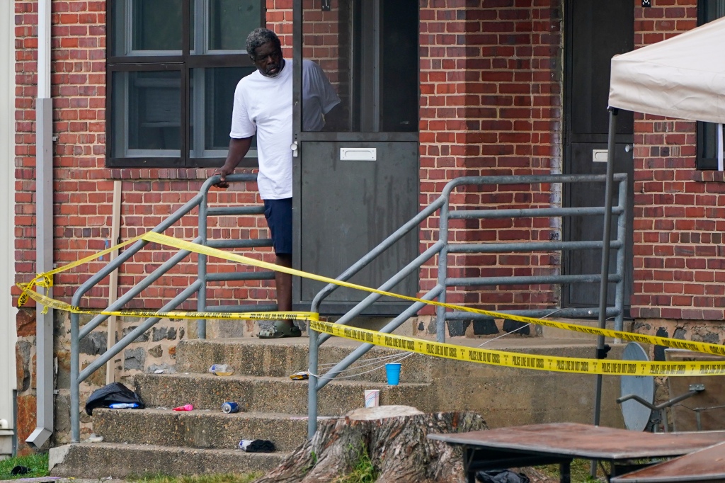 MAN OUTSIDE HIS HOME IN BALTIMORE 