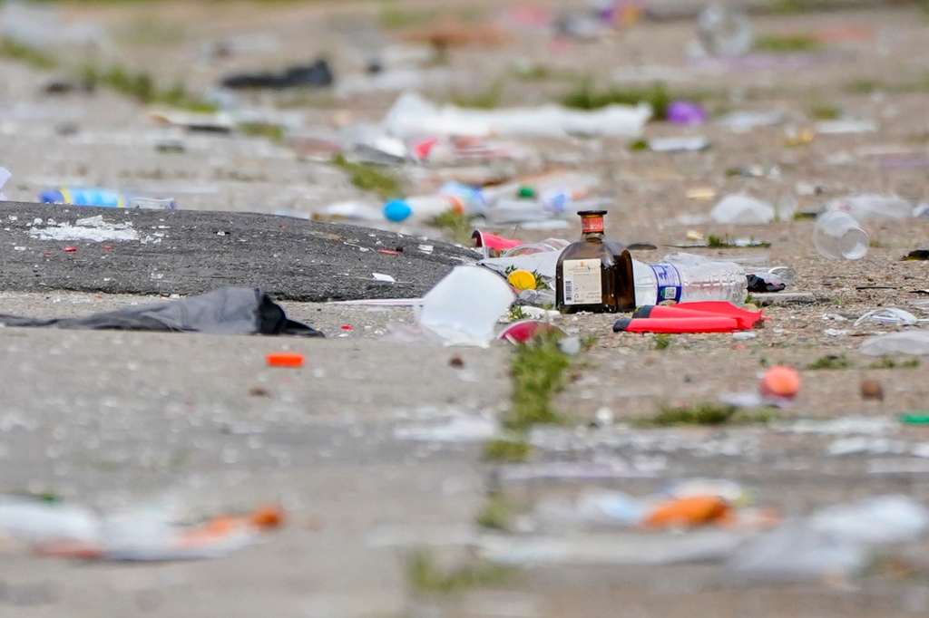 Party debris is seen in the area of a mass shooting incident in the Southern District of Baltimore, Sunday, July 2, 2023.