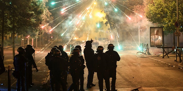 Firecrackers light up the sky over France's riots