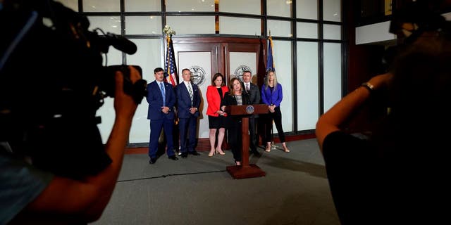 Wide shot of press conference