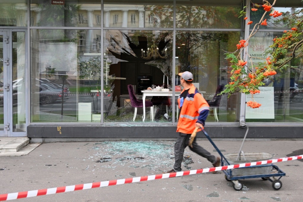 A man walks past a damaged building after a reported drone attack in Moscow, Russia, on July 24, 2023. 