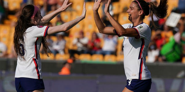 Alex Morgan celebrates with Rose Lavelle