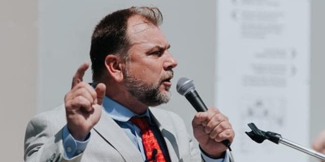 Pastor Artur Pawlowski with microphone