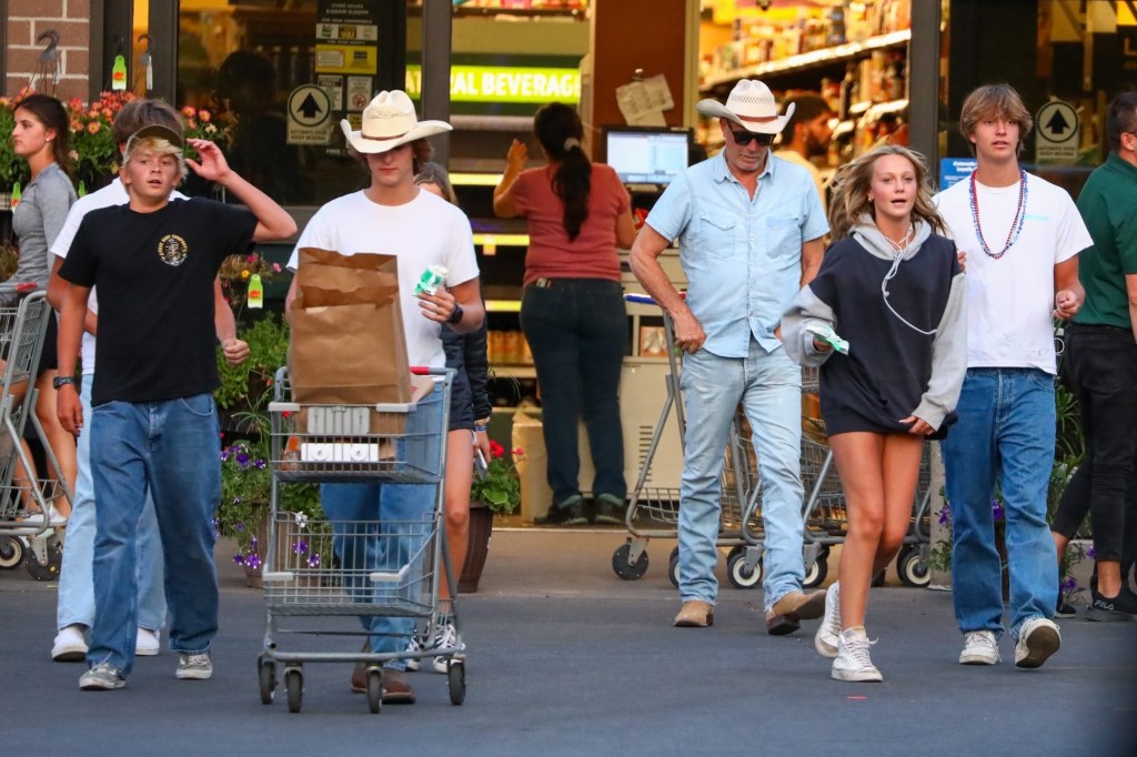 Costner's kids appeared to be in good spirits despite the drama surrounding their parents as they were seen heading toward the car in the grocery store's parking lot.