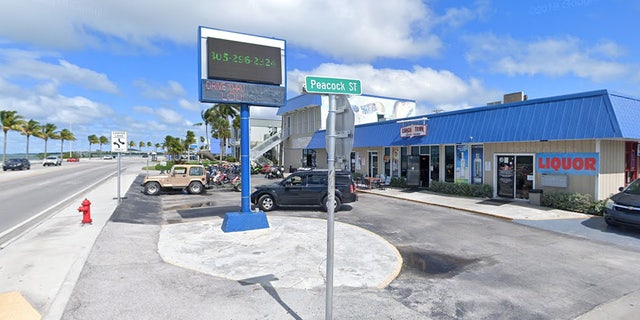 Conch Town Bar and Lounge shown across the street from the ocean.