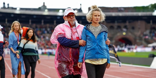 Protester escorted off the track