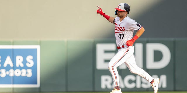 Edouard Julien rounds bases after home run