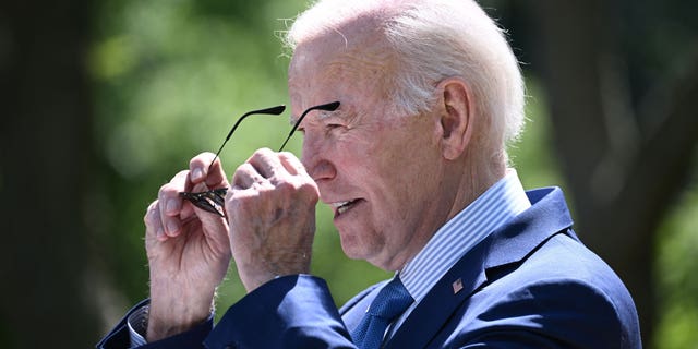 President Biden putting on his sunglasses