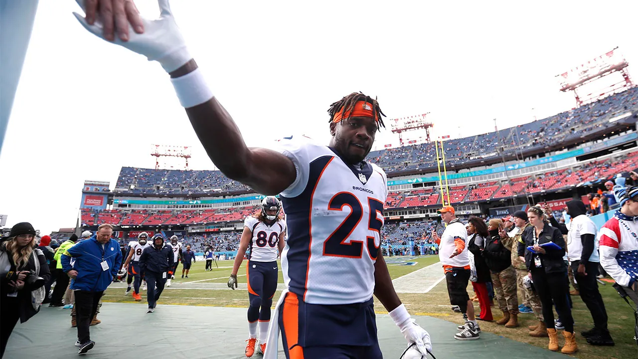 Melvin Gordon III high fives a fan