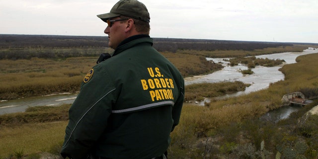 A USBP official by a river