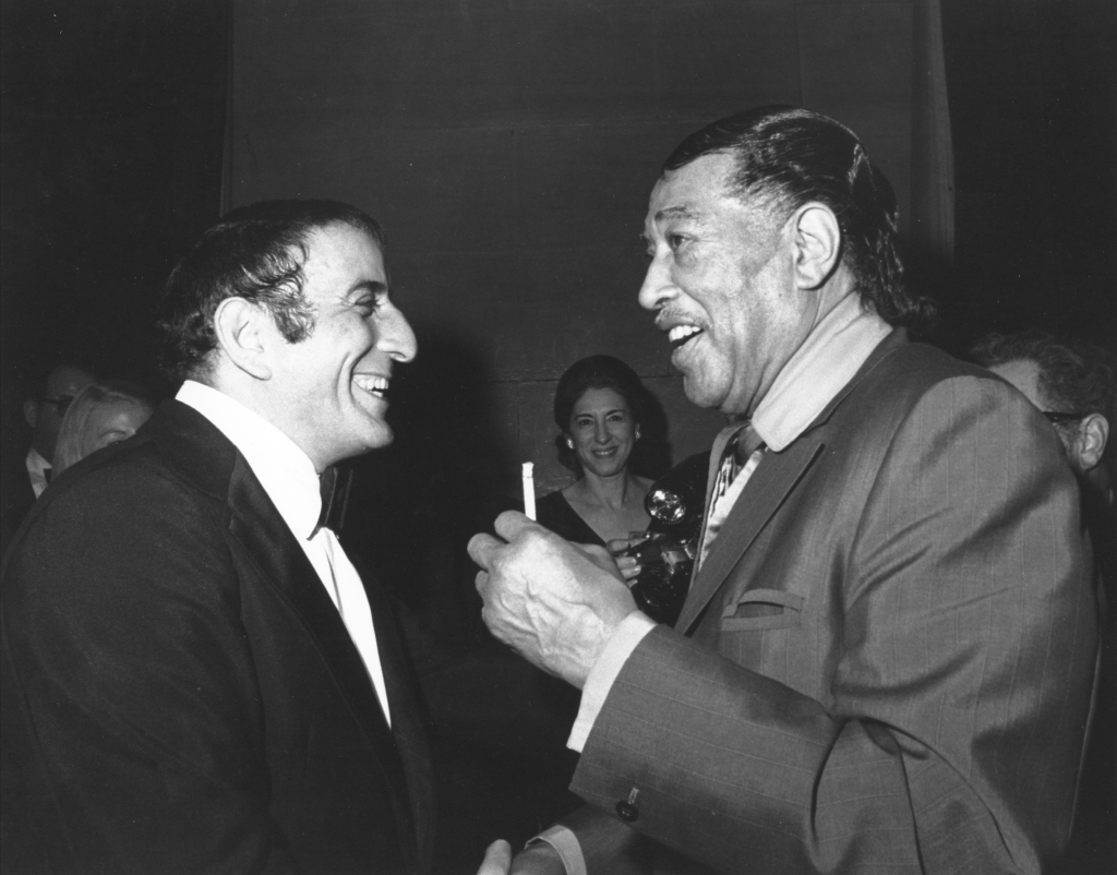 Bennett and composer Duke Ellington share a laugh in circa 1970. 