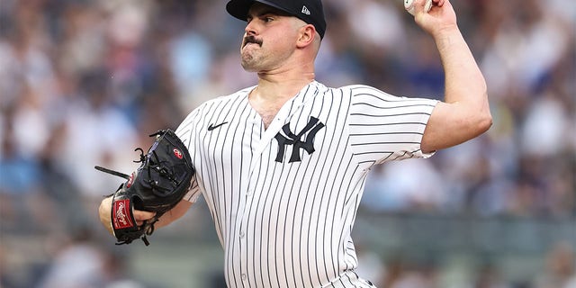 Carlos Rodon pitches against the Cubs