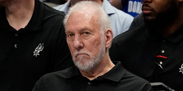 Gregg Popovich sits