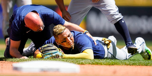 Isaac Paredes on his stomach