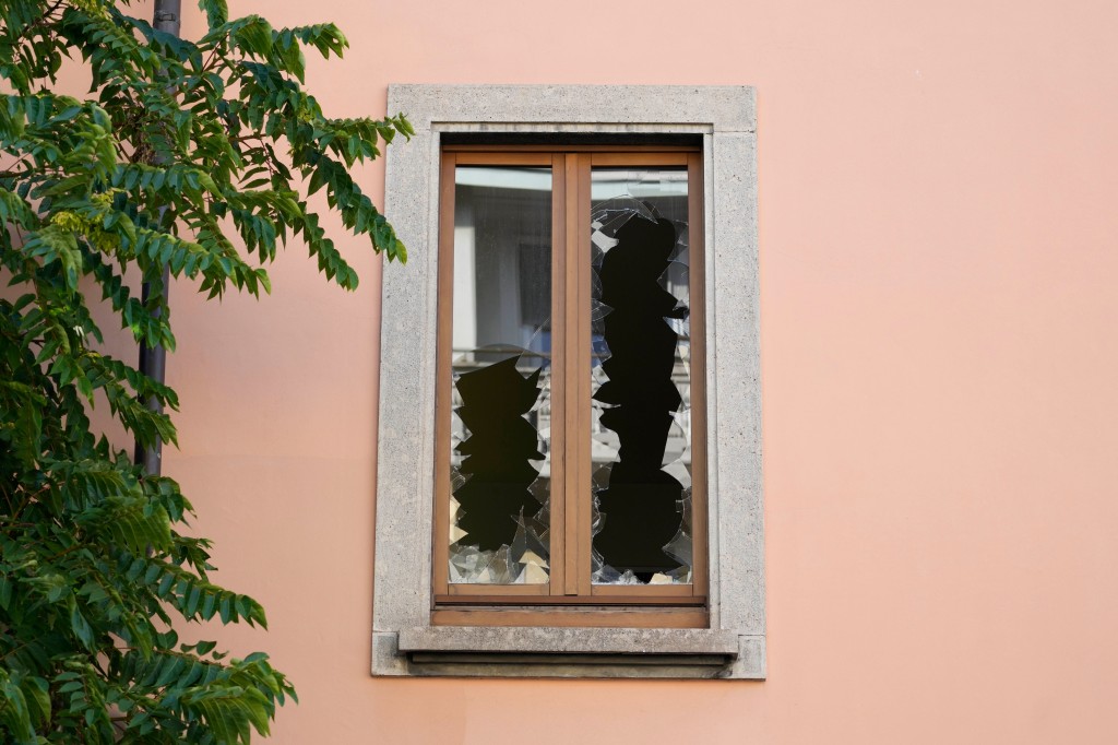 The broken glasses of one of the windows at the "Casa per Coniugi" nursing home is seen in Milan, Italy, on July 7, 2023. 