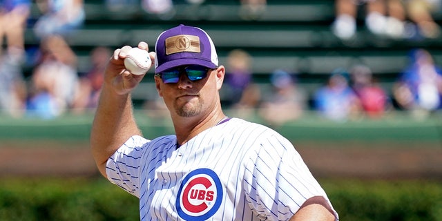 Jim Foster throws a ceremonial first pitch