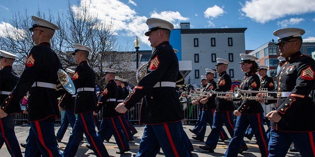 US Marines marching through the street.