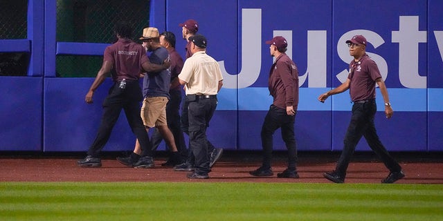 Security escorts a fan