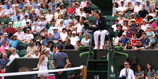 Mirra Andreeva talks with the umpire during her fourth round match at Wimbledon