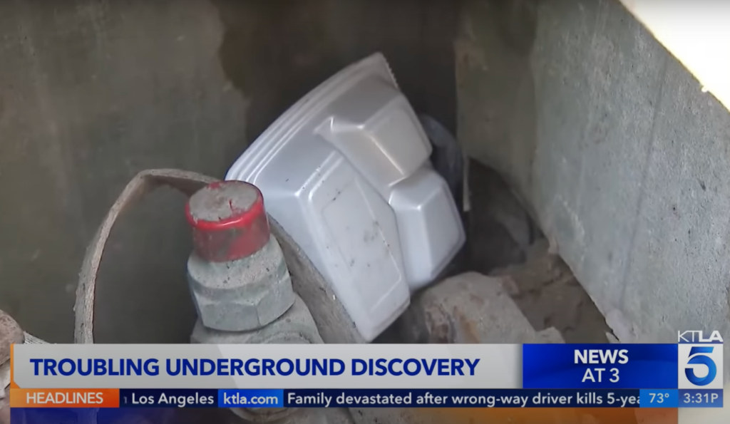 Food containers and other trash were found in the vault after the man was arrested.