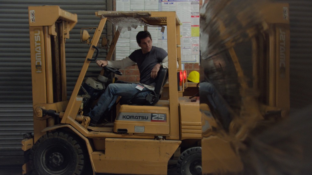 James Marsden sitting in a tractor. 