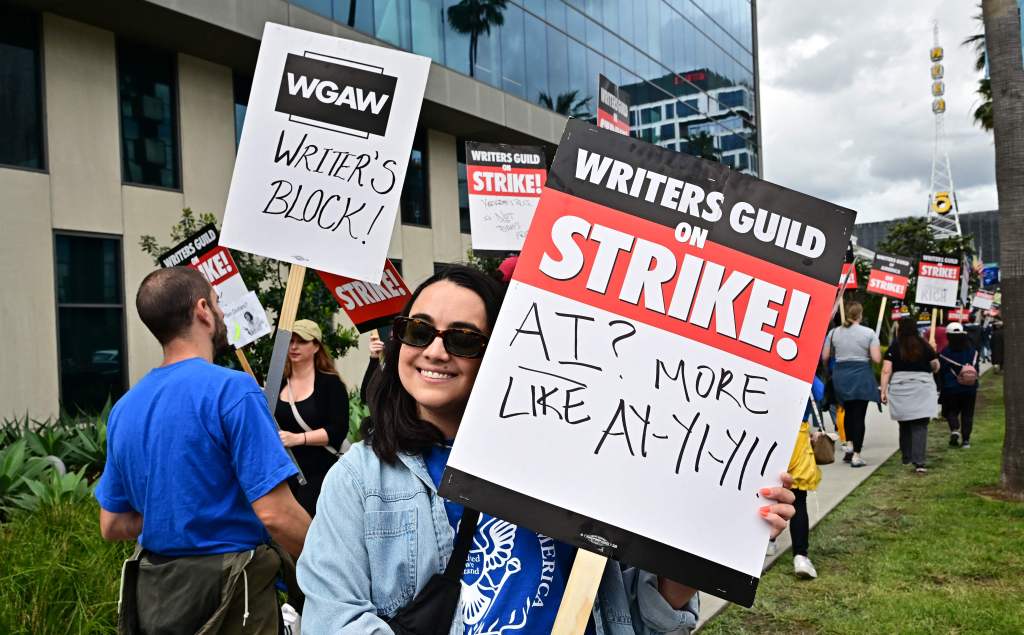 Writer Ilana Pena holds her sign on the picket line on the fourth day of the strike by the Writers Guild of America in front of Netflix in Hollywood, California, on May 5, 2023.