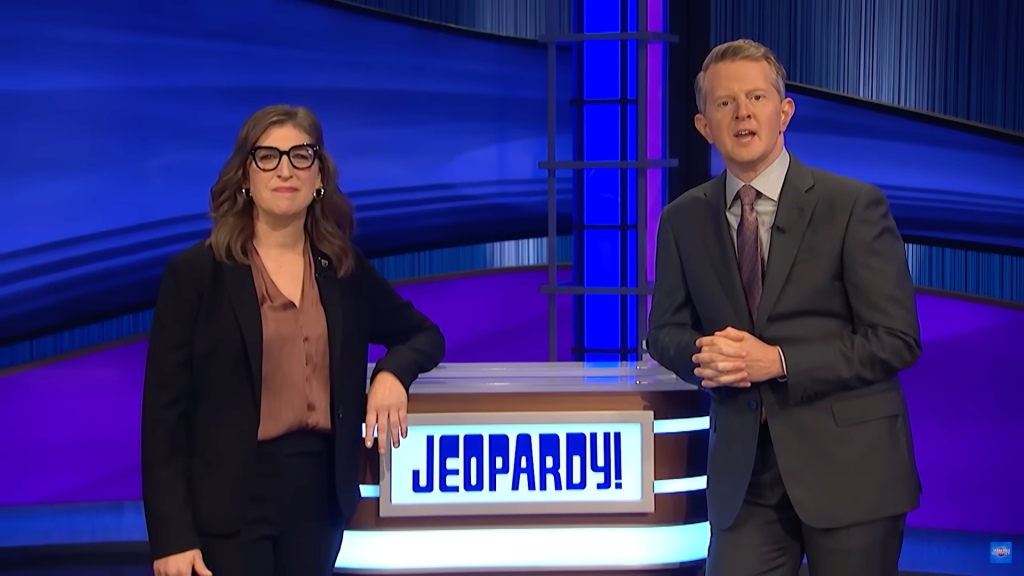 "Because I'm an actor person, I grew up in a world where everyone was, like, 'You're amazing,' and it's sometimes hard for me to lean into believing people," said Bialik, pictured here with Ken Jennings on the set of "Jeopardy!"