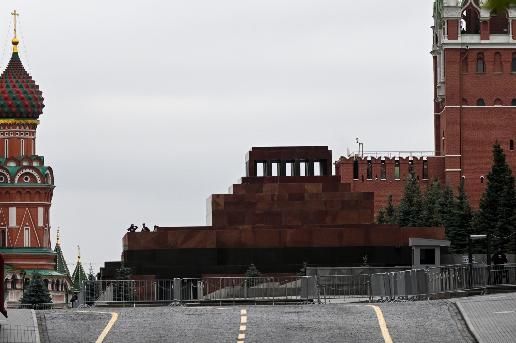 Two servicemen stand on a tribune of Lenin mausoleum closed due to security reasons, Red Square in Moscow, Russia, Saturday, June 24, 2023. 