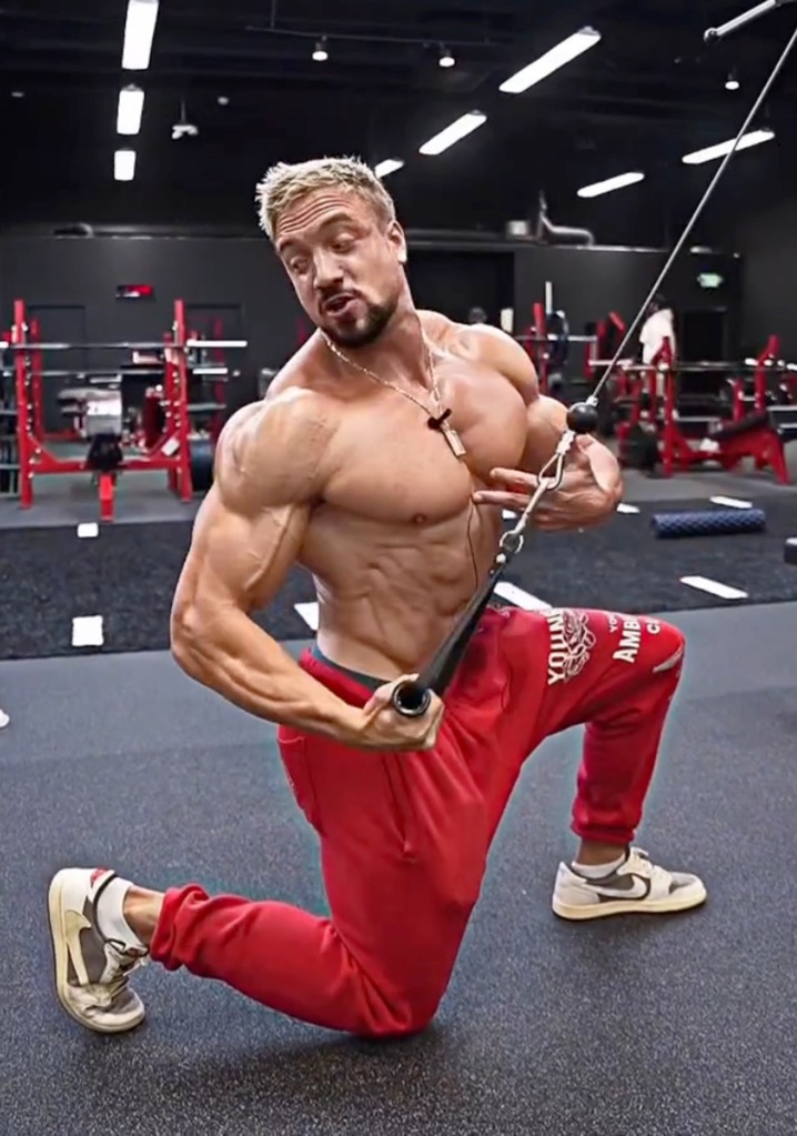 Jo Linder working out shirtless in red pants
