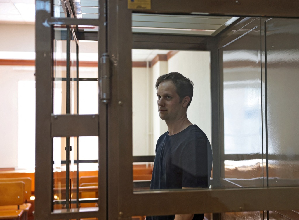Gershkovich stands behind a glass wall before a court hearing to consider an appeal against his detention, in Moscow, Russia.