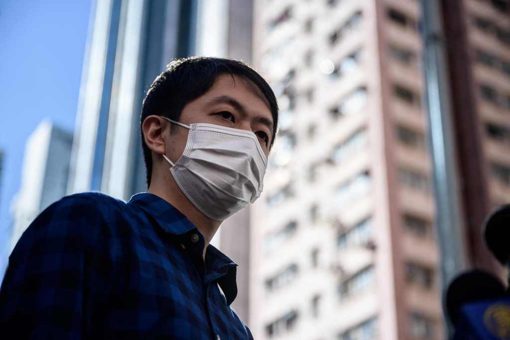 Former lawmaker from Hong Kong's pro-democracy opposition Ted Hui speaks to the media as he leaves the Western Police Station in Hong Kong on November 18, 2020.