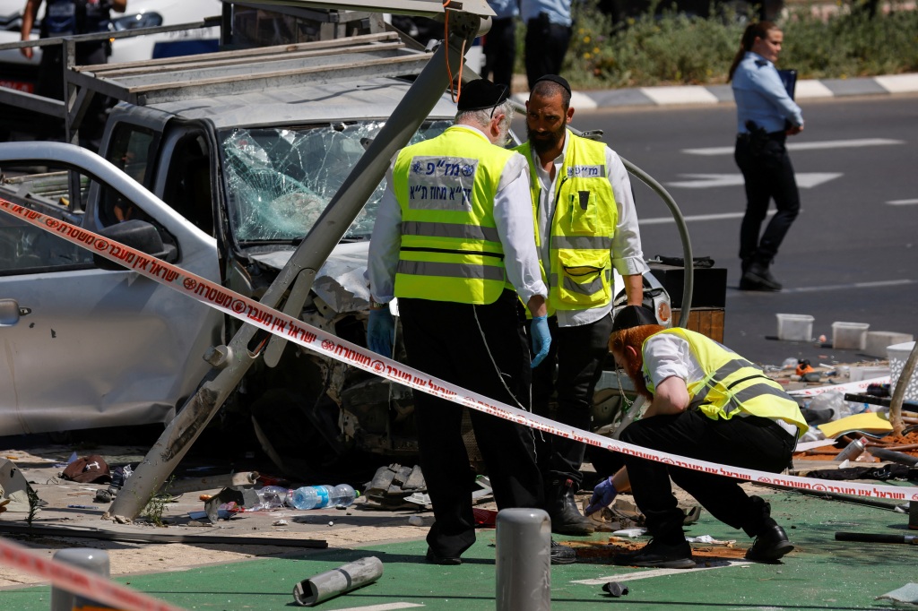 Israeli emergency personnel at the scene of the attack in Tel Aviv, Israel July 4, 2023. 
