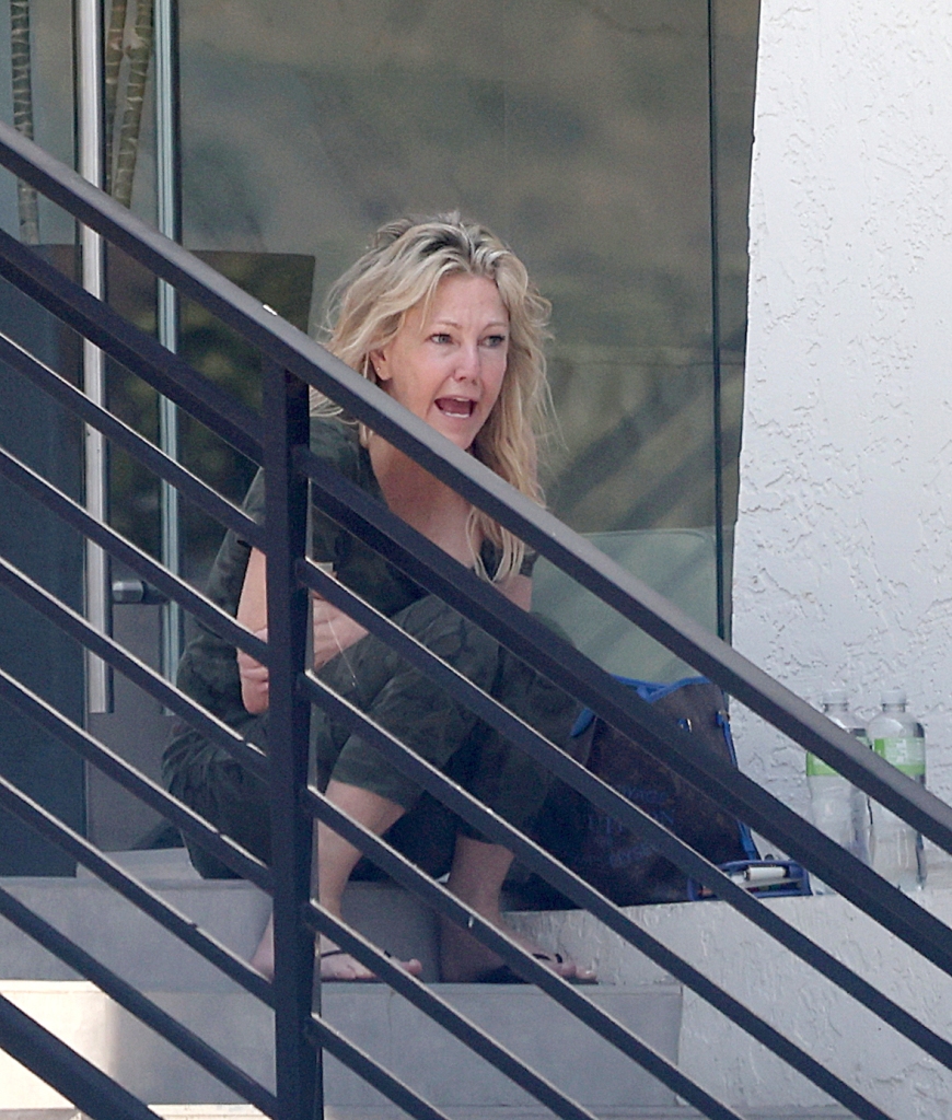 The shocking snaps, taken in Malibu, Calif. on Jun. 29, show the 61-year-old — who has a well-documented history of struggles with substance abuse and mental health issues —  steadying herself on the ledge of an office building after an undisclosed appointment. 