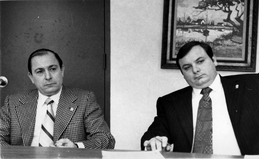 Joe and Anthony Colombo seated at a table