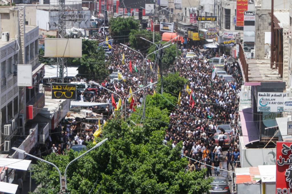 Mourners carry bodies of Palestinians killed in clashes the previous day in the Israeli military operation in Jenin.