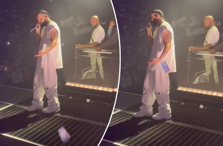 Drake shrugs off phone thrown at him onstage