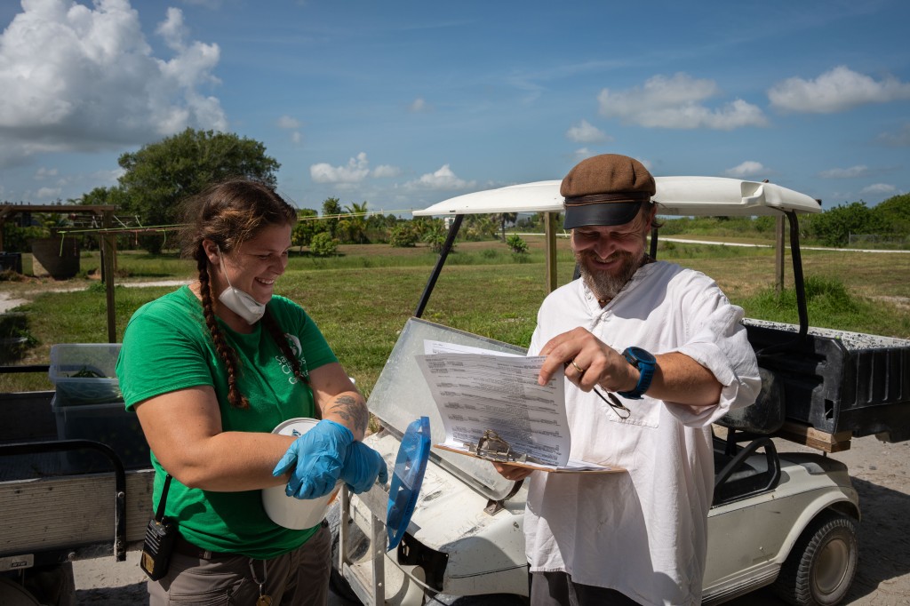 Kirsten Chamberlain, Care Technician and Andrew Halloran, Director of Chimpanzee Behaviour and Care, discuss the day's schedule.