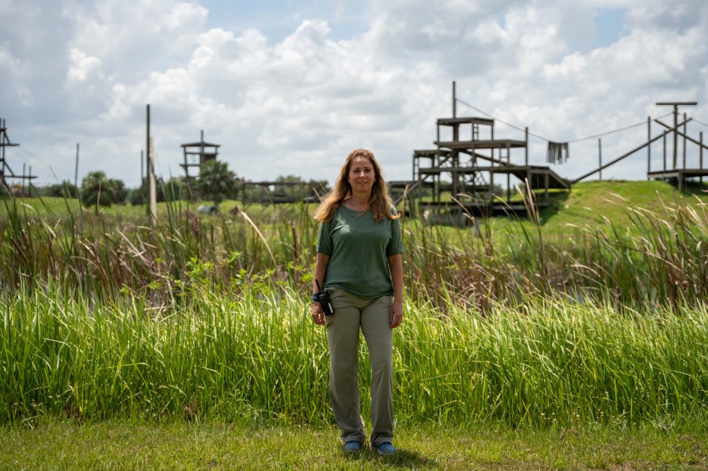 Anna Paula Taveres, CEO, stands in front of the main island, Air Force.