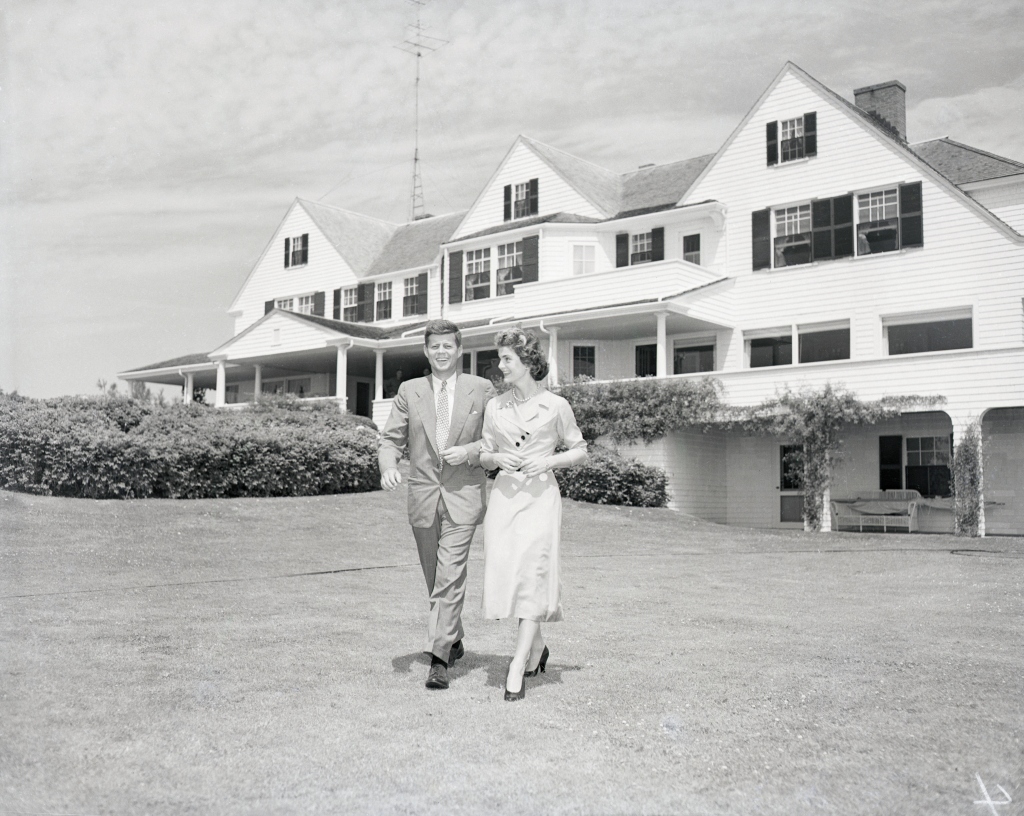 JFK and Jackie strolled across the lawn after announcing their engagement. 