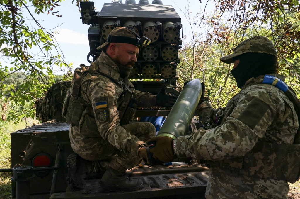 Ukrainian servicemen loading shells into a RAK-SA-12 small multiple launch rocket system near Bakhmut on July 10, 2023. Pence said he would continue to give Ukraine “what they need to win” if he is elected.
