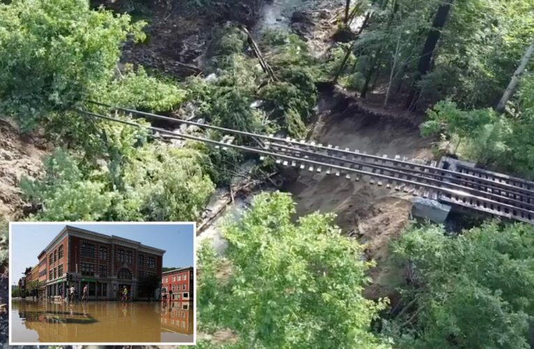 Aerial footage shows railroad tracks suspended in air after Vermont flooding wipes out trestle