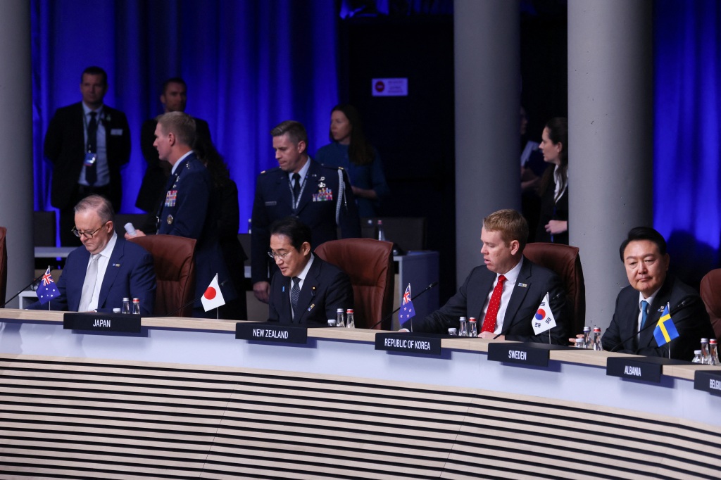 Japan's Prime Minister Fumio Kishida, New Zealand's Prime Minister Chris Hipkins, South Korea's President Yoon Suk Yeol, attends a meeting of the North Atlantic Council during a NATO leaders summit in Vilnius, Lithuania.