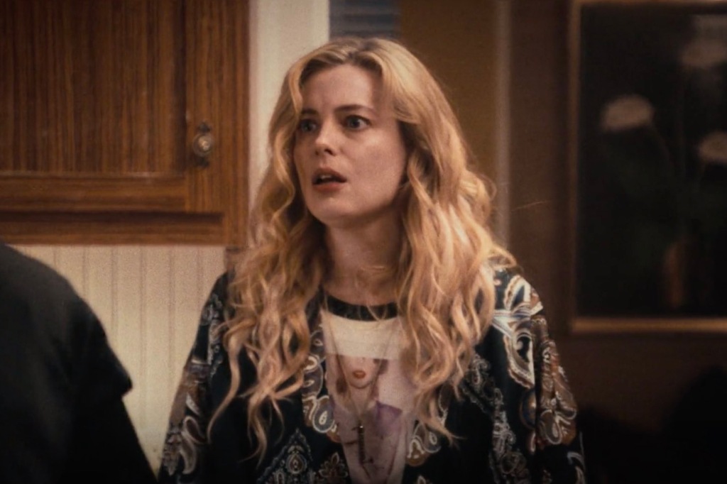 Gillian Jacobs looks at someone off-screen.