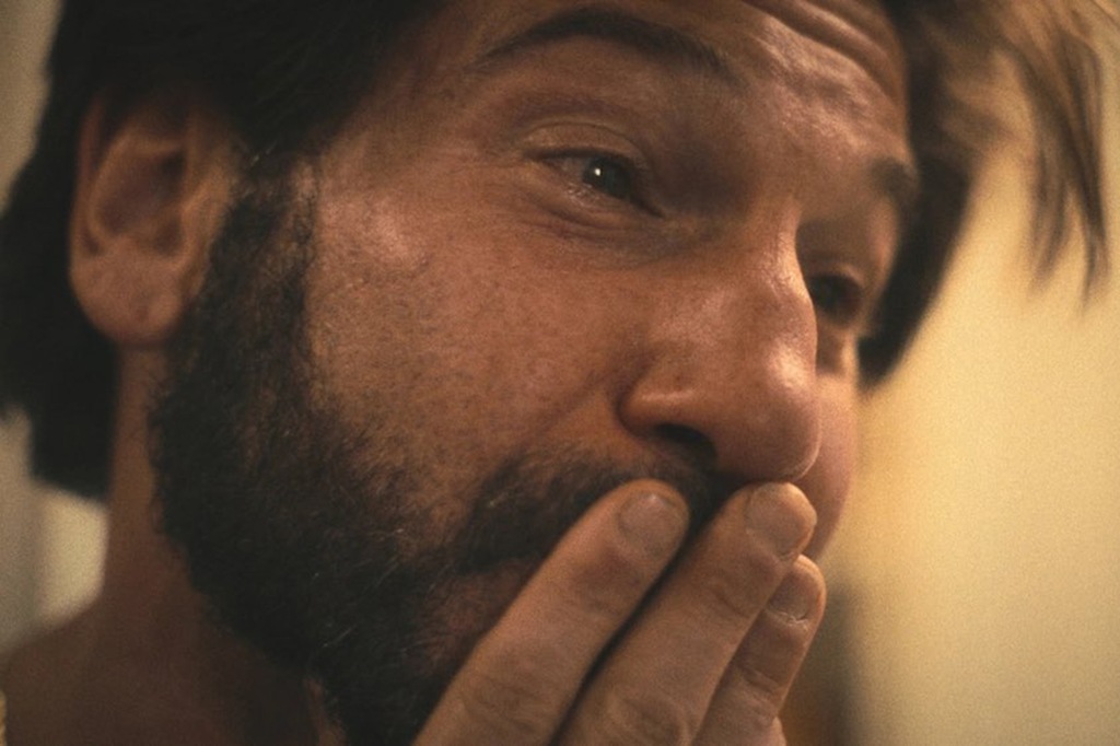 A close-up of John Bernthal shows him crying.