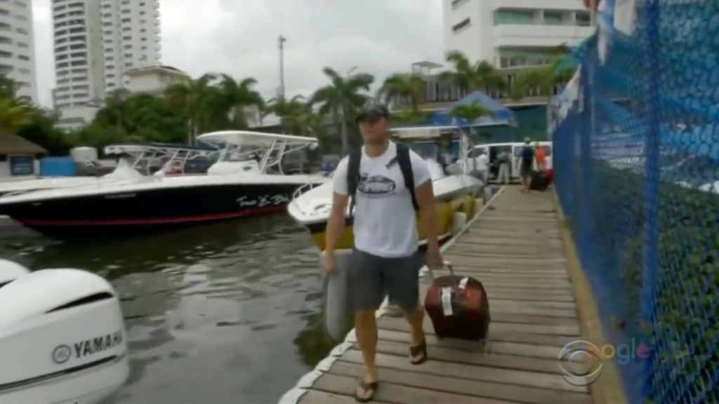Tim Ballard in the CBS News segment walking in a marina.