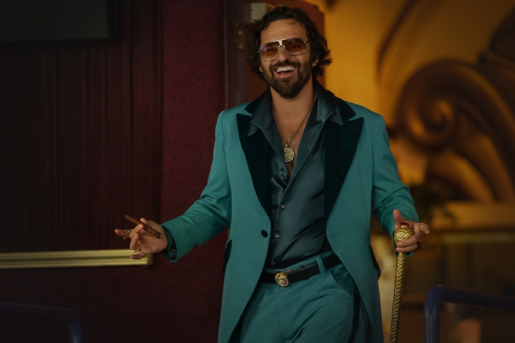 Johnson wears an all-turquoise suit in "Minx," complete with sunglasses and a cigar.
