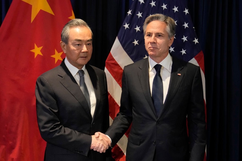 U.S. Secretary of State Antony Blinken, right, shakes hands with Chinese Communist Party's foreign policy chief Wang Yi during their bilateral meeting on the sidelines of the Association of Southeast Asian Nations (ASEAN) Foreign Ministers' Meeting.